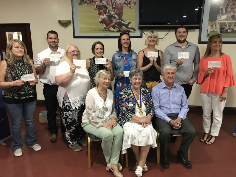 Left to right    The Dragons, Rtn. Aukje Clegg OBE, Wigan Rotary President Gwyneth Millard, Peter Cheetham and the representatives of the winning teams