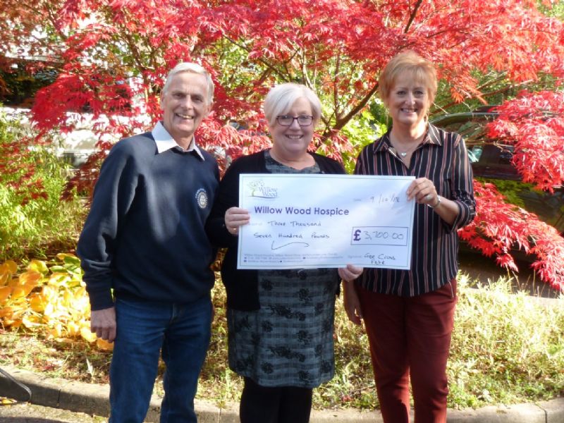 Pictured L to R Gee Cross Fete Chair Alan Oldham, Hyde Rotary President Karen Dorney Presenting the cheque to Elaine McConnell Event Community Fundraiser at The Hospice.