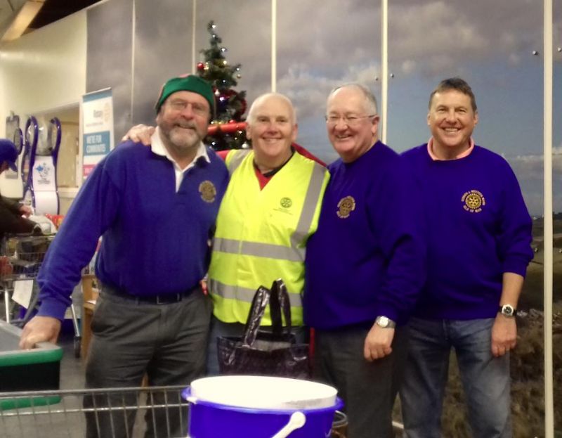 Rotary Club Members, Brian Coole, John Lindon, Ashton Lewis and Steph Lowe enjoy the Christmas festivities when bag packing at Shoprite Port Erin.