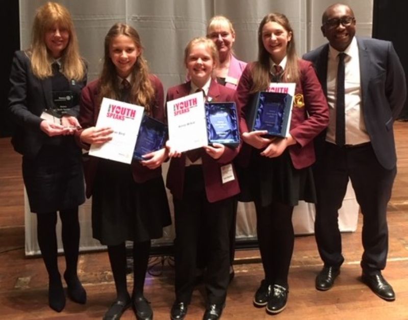 Photograph:Champions Esther, Anna, and Amelie with Headteacher Mr Botwe, Teacher Mrs Burke and Rotarian Mary Grant. 