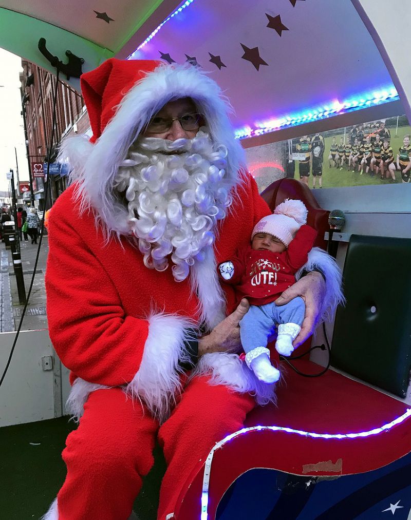 The photo shows baby Sara Patricia who came to see Santa at only 6 days old!