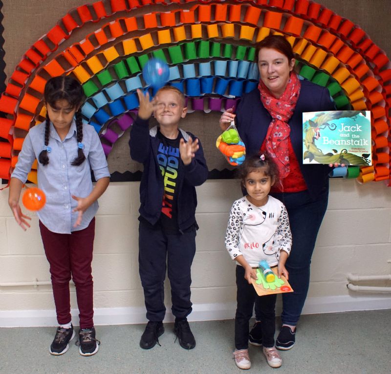 The photo shows pupils enjoying toys provided for extra rewards