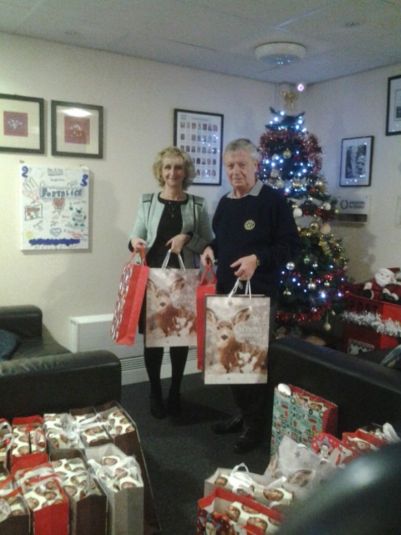 Rtn. Alan Wilkinson presenting the gifts to Gill Smallwood, the Chief Executive of Fortalice