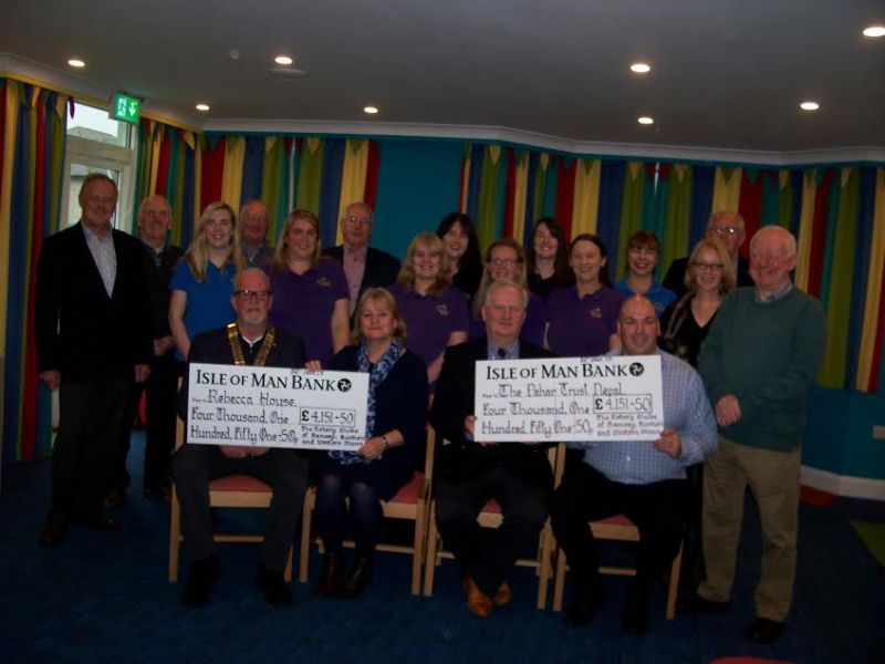 Pictured here receiving their cheques from the Presidents of the two clubs, Marc Pons Burt of Ramsey and Geoff McCann of Rushen and Western Mann are Anne Mills, Chief Executive of Hospice Isle of Man and Howard Green of The Pahar Trust Nepal. Also attendi