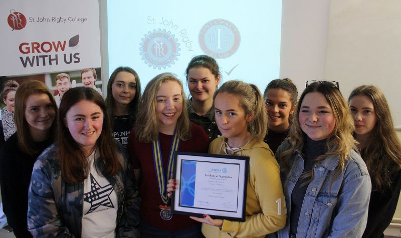 The photograph shows Club President Mia Cliffe, Vice President Chelsy Boyne-Nelson, Secretary Melissa Molyneux and Treasurer Emily Warburton with the other Club members at the handover of the Club’s official registration certificate from Rotary Inter