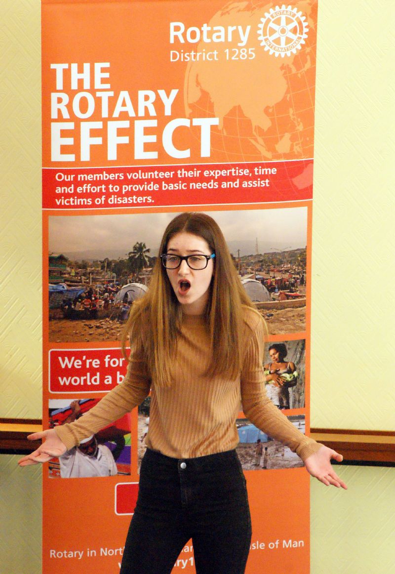 The photo shows the performance by Olivia Kiernan of All Hallows School in the vocal performances section - good publicity for Rotary as it includes one of the new banners!!