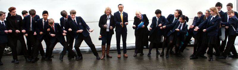 Photo: The Macclesfield Academy Assistant Director Noorul Choudhury, Rotarians Claudia Dobbie and Mary Grant, and Students stretching ‘Graphene’.  Can you see it?!