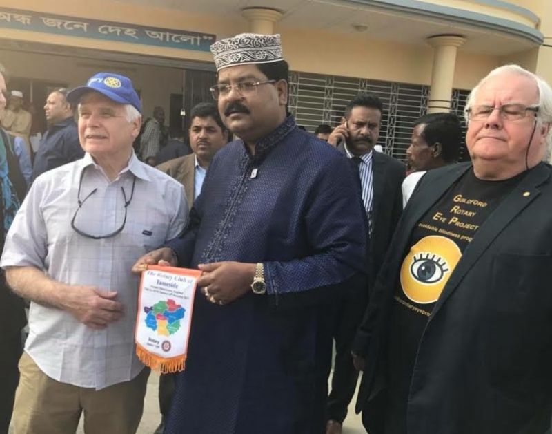 President Andy Williams with John Miles Guildford Rotary Eye Project and Bangladesh Minister outside potential Eye Hospital