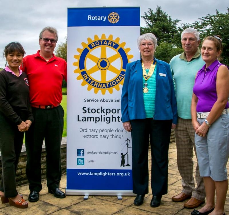 Mark ( in red ) and his team with President Linda