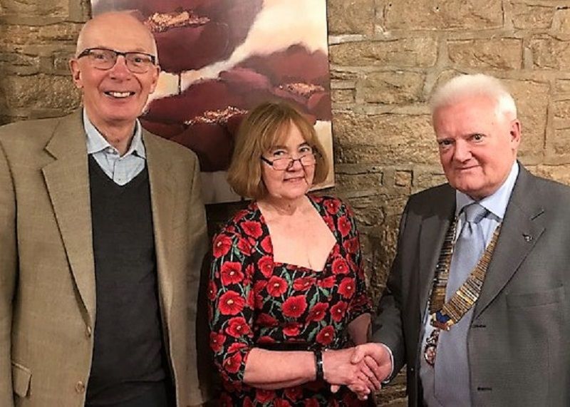 Pic of Turton rotary club latest member Lynne Joule welcomed by president Peter Gaskell right and her sponsor Andrew Waller.