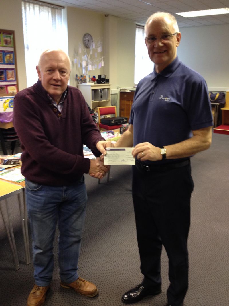 Notes: Photograph attached of Rotarian Bernard Murphy presenting the cheque.