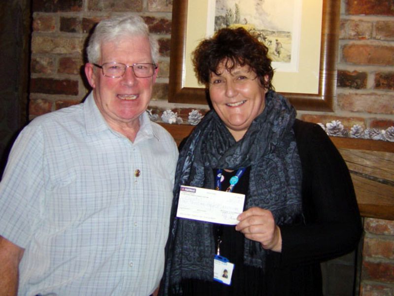 Nicola Doran from Christie's Hospital receiving a cheque from Biddulph Rotary Past President, David Ash